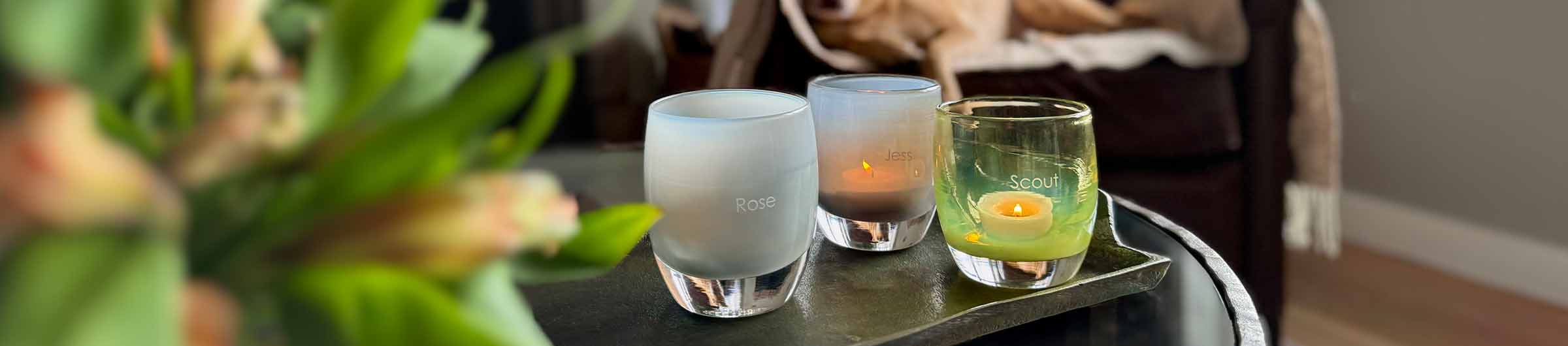 four paws, nuzzle, and off the leash, hand-blown glass votive candle holders etched with pet names.