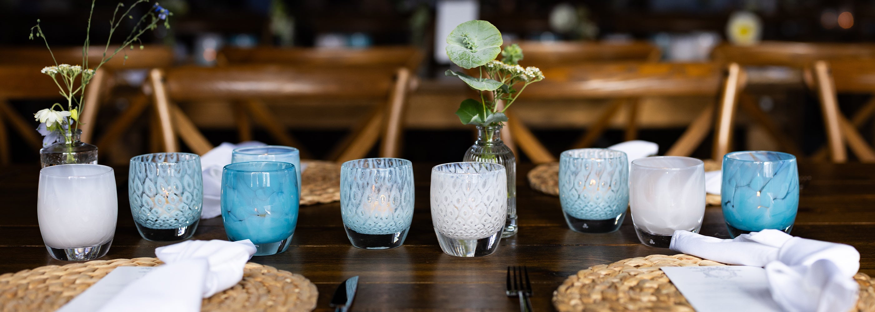 table set with hand-blown glass votive candle holders