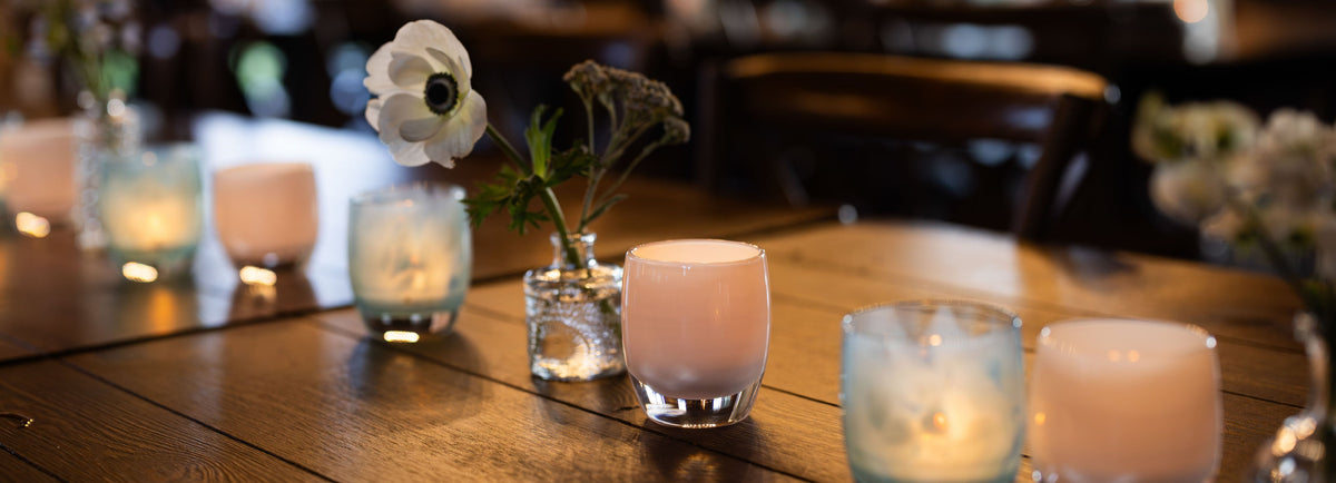 table set with hand-blown glass votive candle holders