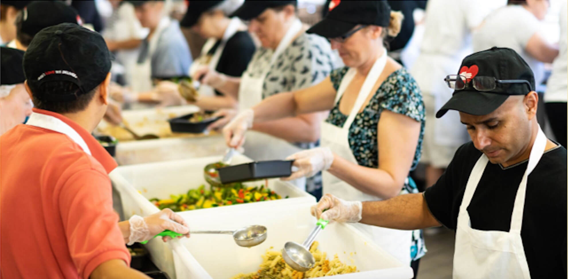 people packing pre-served meals