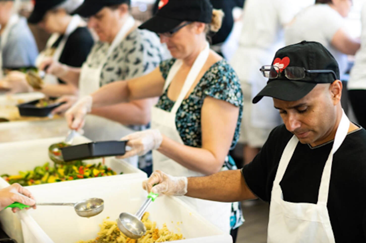 people packing pre-served meals