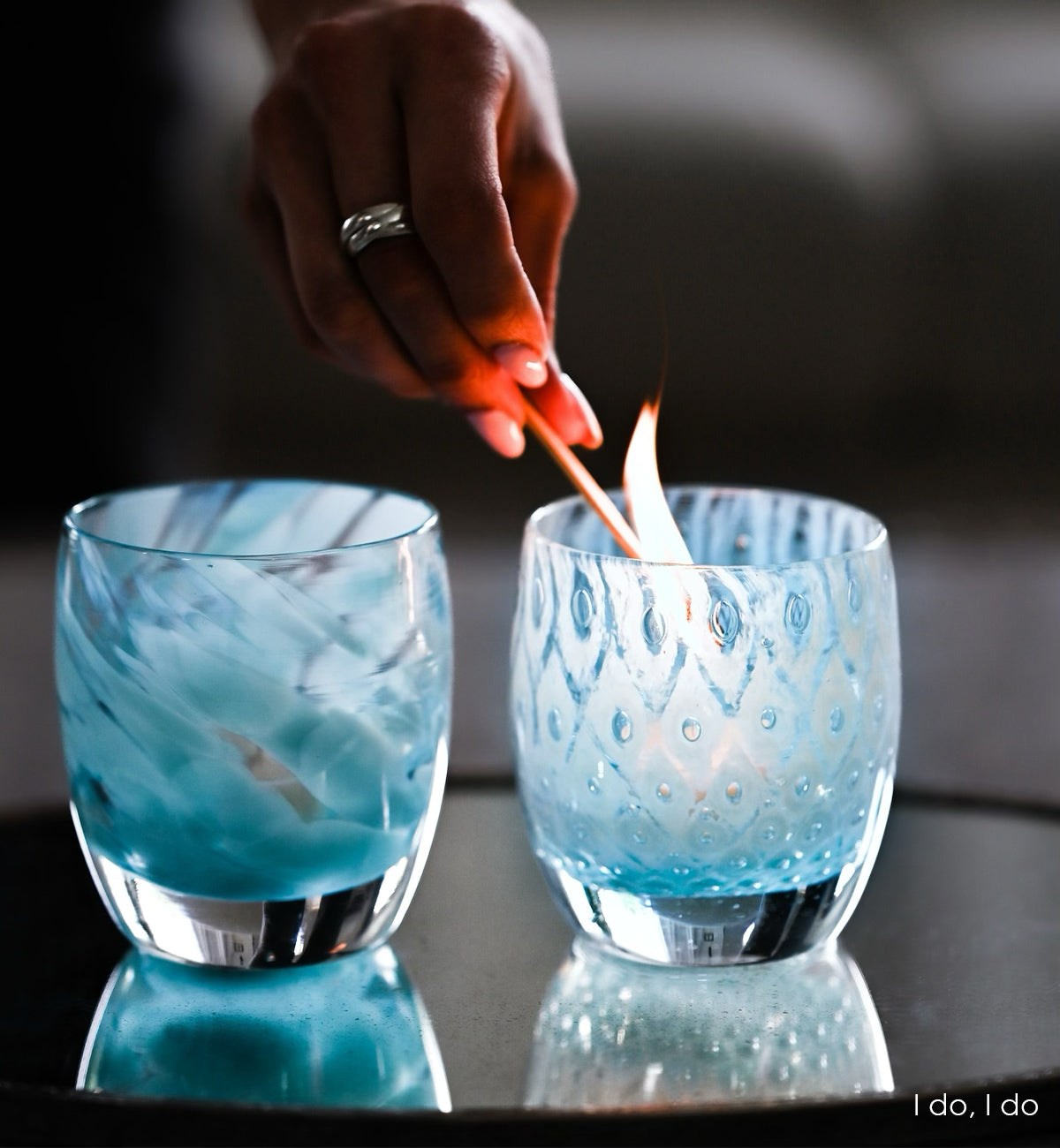 i do, i do is a set of two patterned light blue hand-blown glass candle holders. it includes good choice, a light blue bubble pattern and blessing a mottled blue pattern.