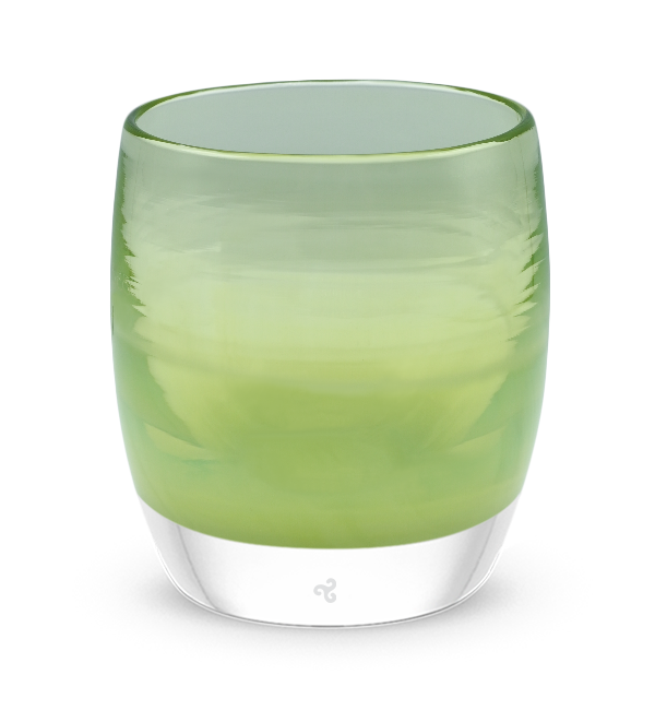 off the leash is a moss green hand-blown glass votive candle holder. transparent towards the top.