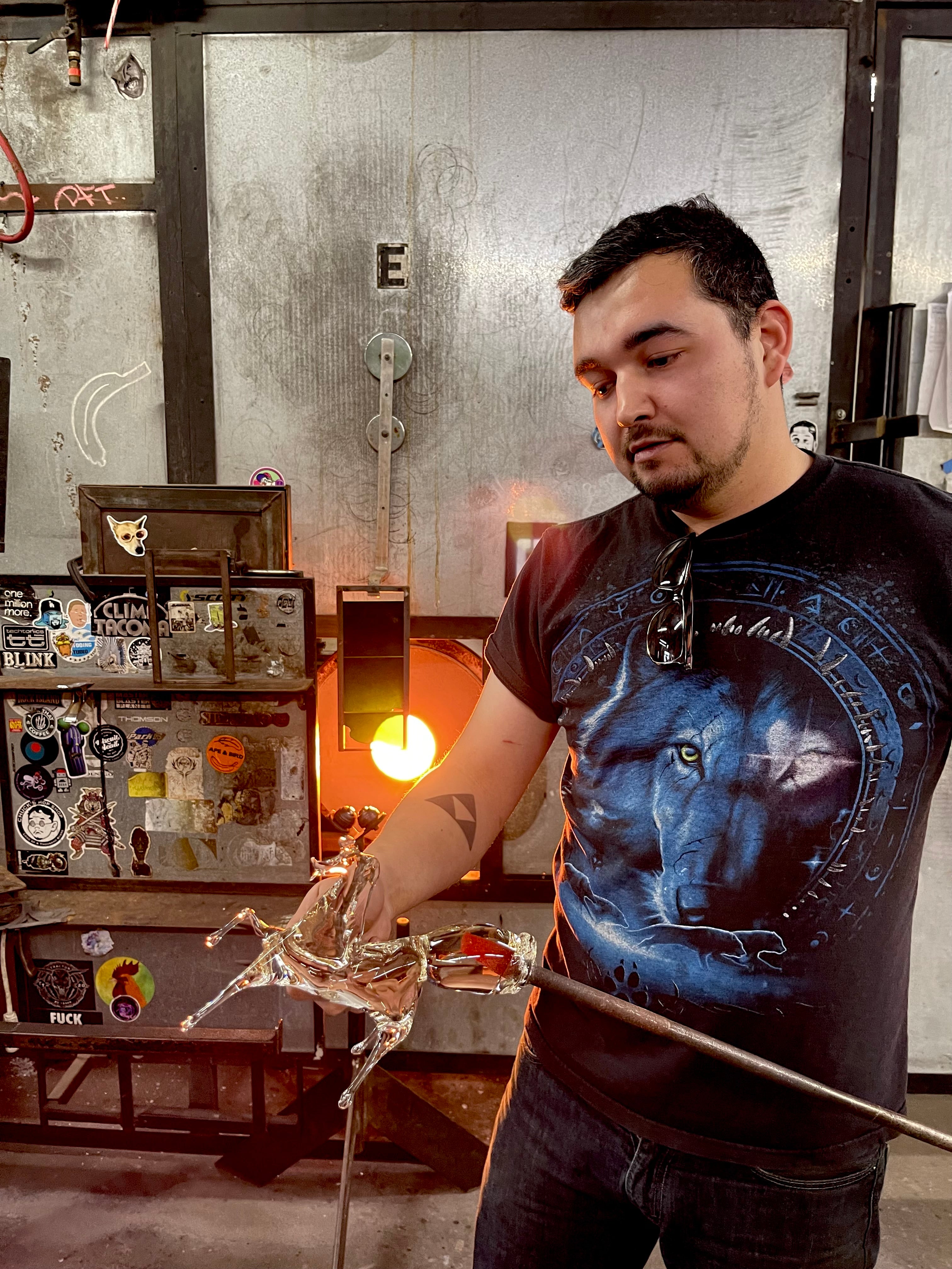 Jeremy, a glassybaby glassblower creating a hand-blown piece of art in a glassybaby hot shop.