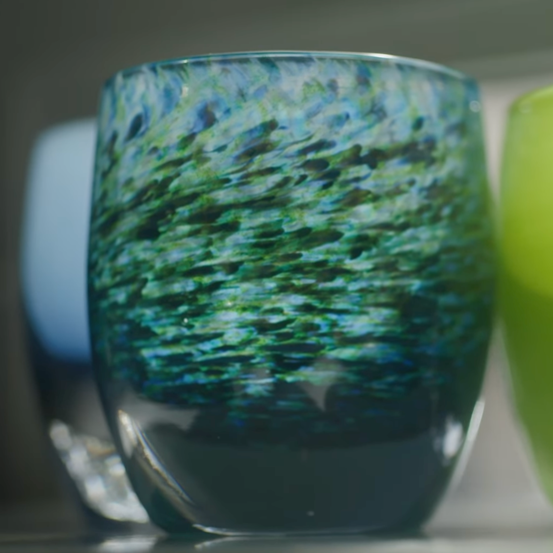 A beautiful blue and green votive candleholder.