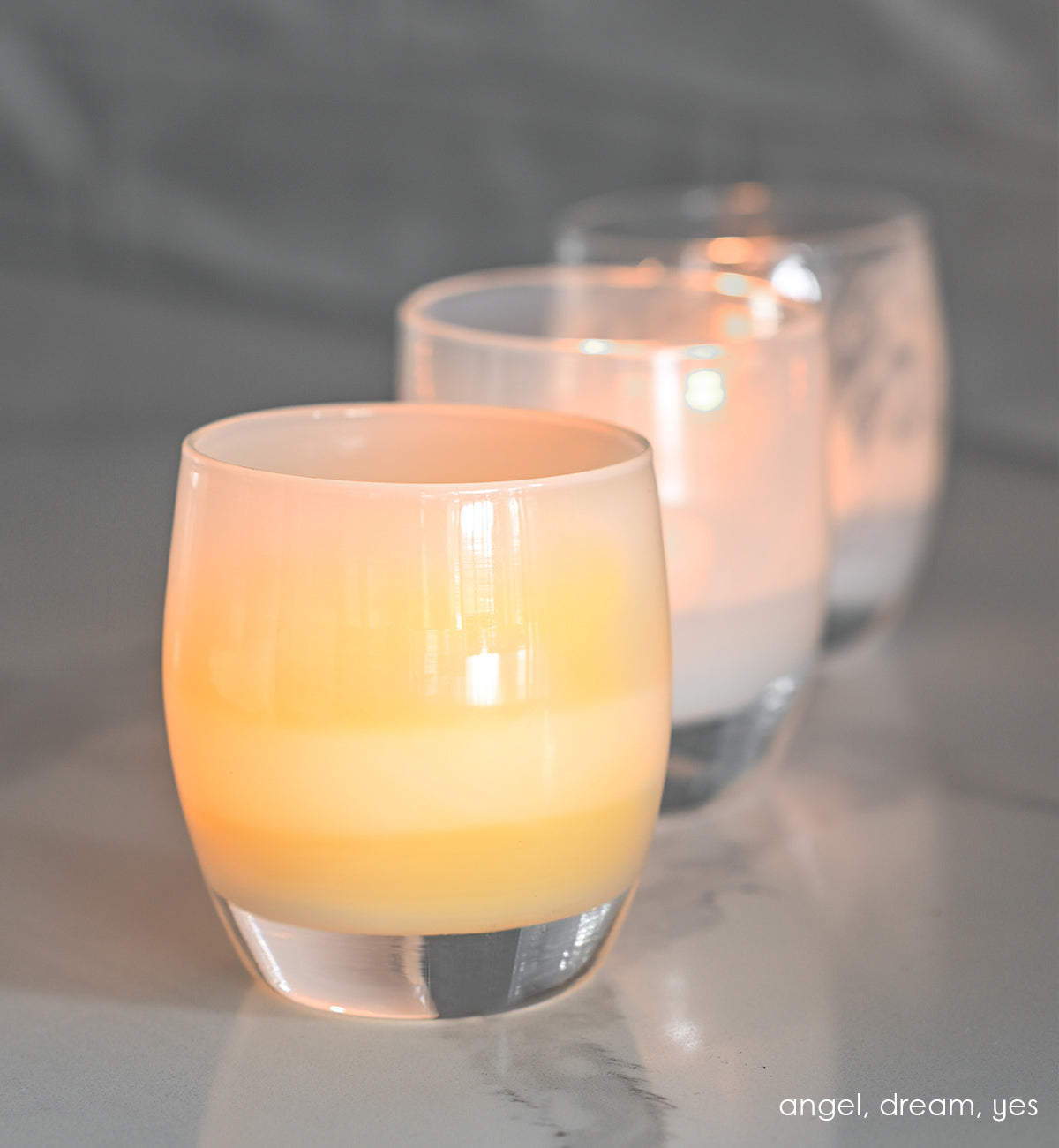 angel light yellow, hand-blown glass votive candle holder