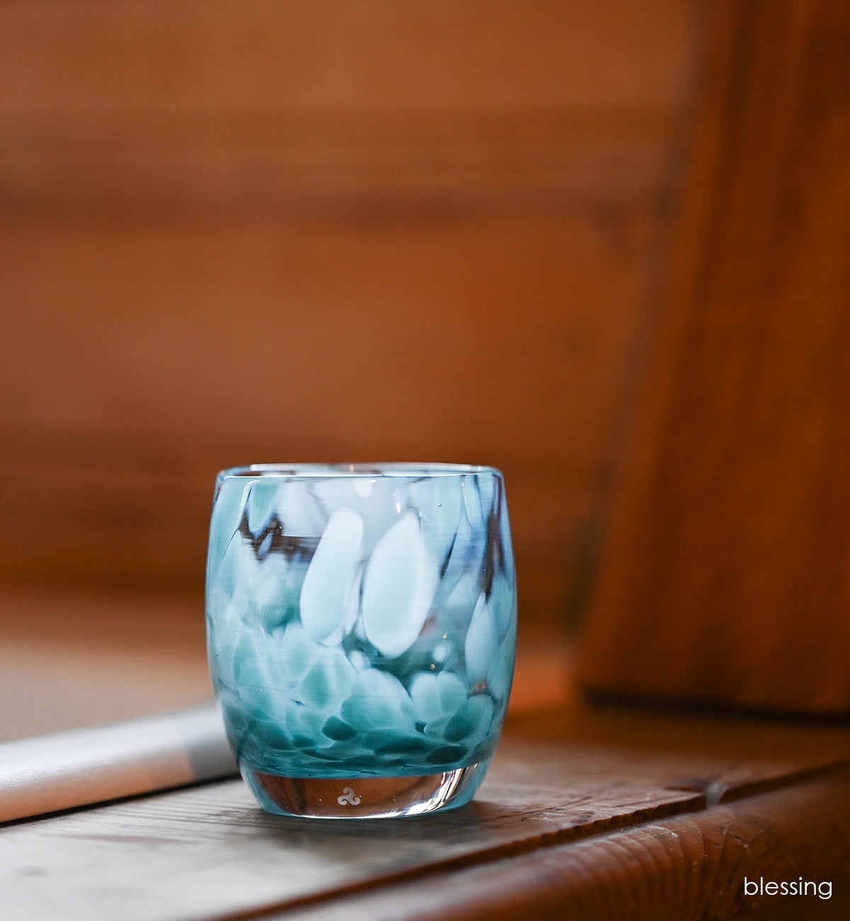 blessing light blue petal patterned, hand-blown glass votive candle holder.