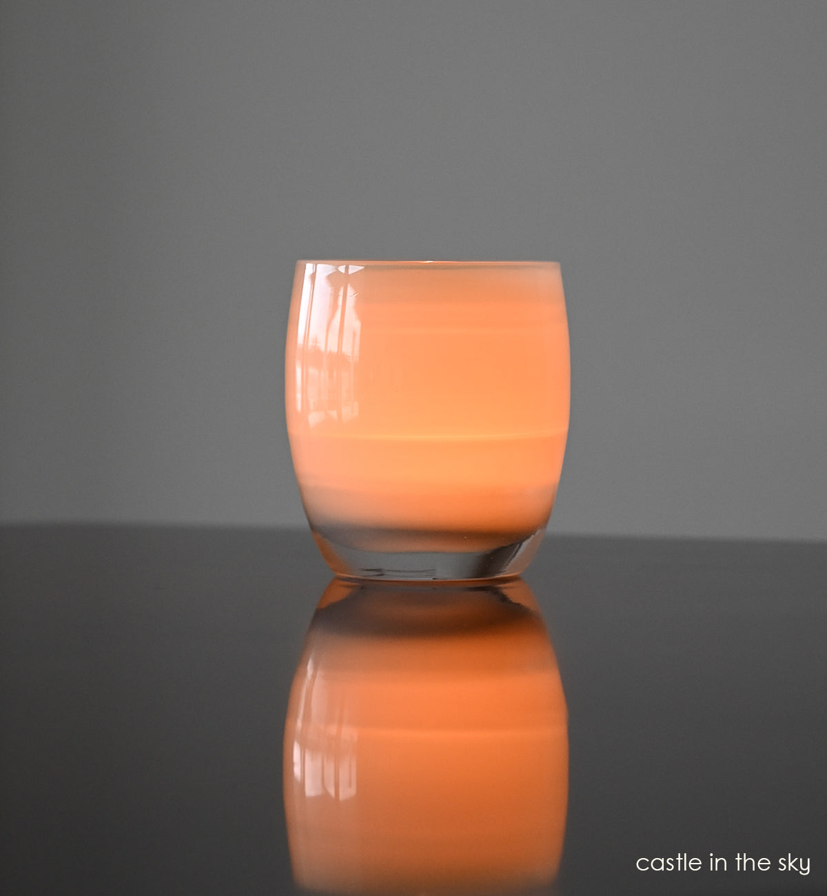 castle in the sky, grey hand-blown glass votive candle holder.