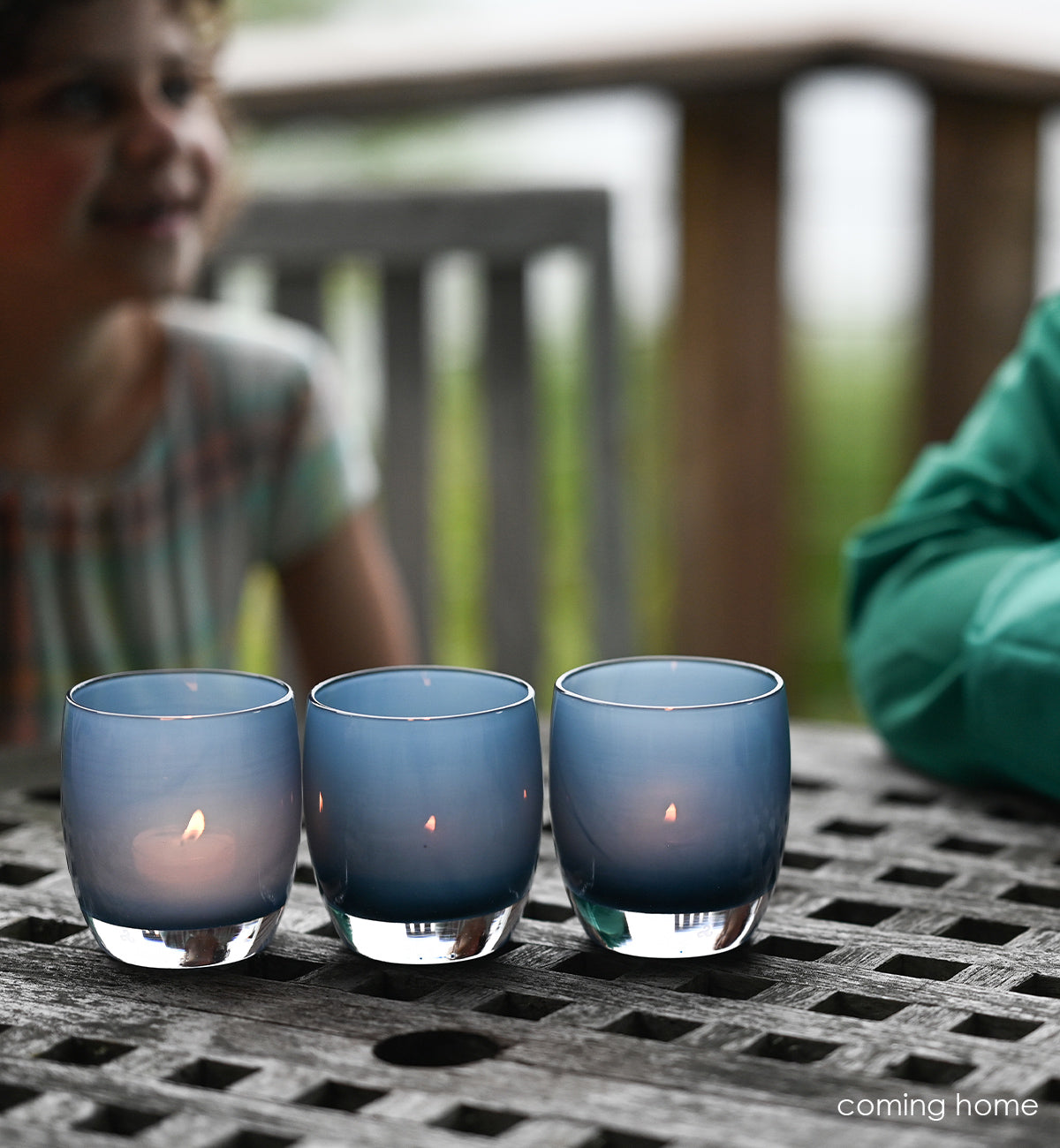coming home a beautiful deep blue, hand-blown glass votive candle holder. the perfect way to celebrate coming home to your loved ones.