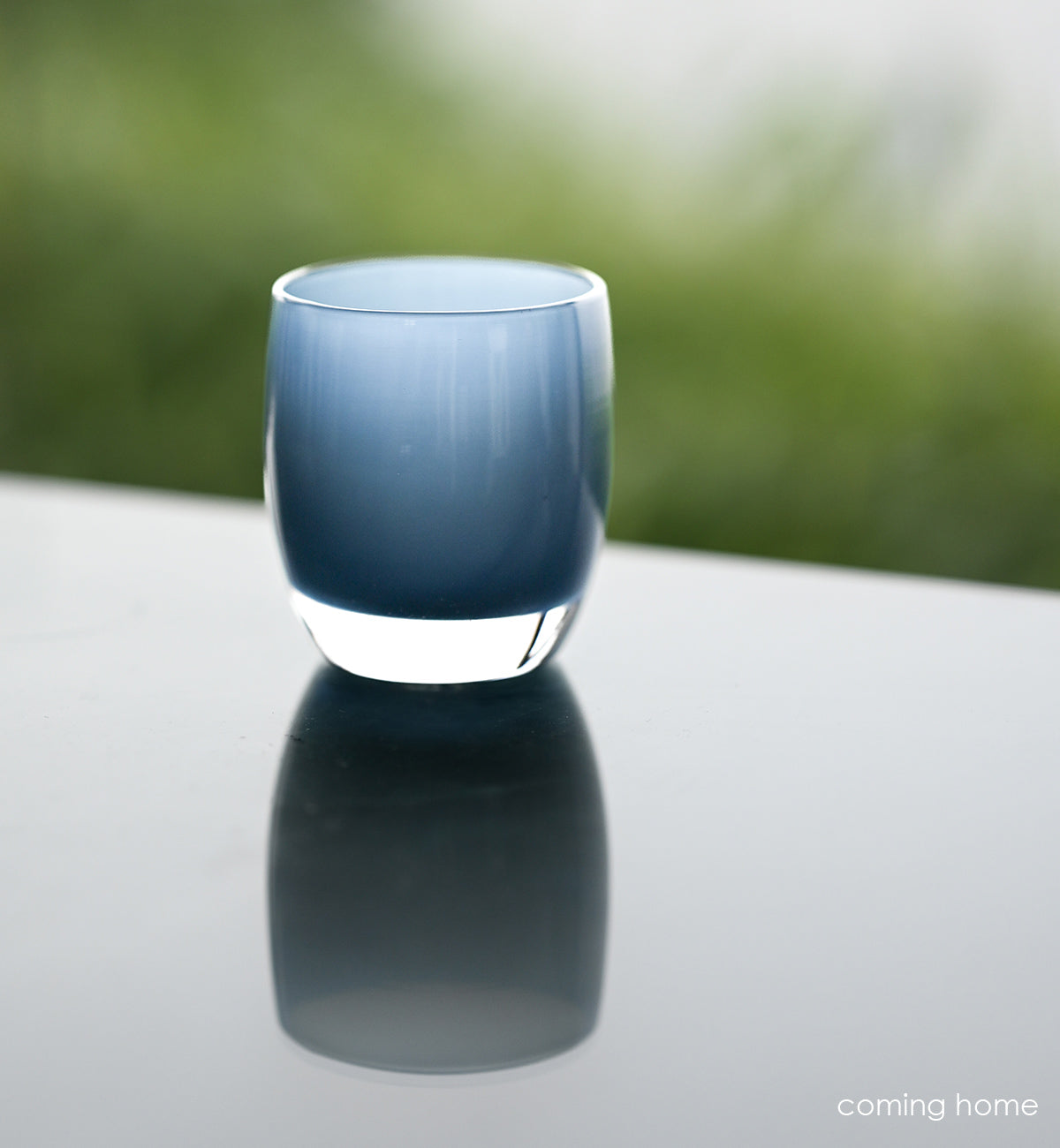 coming home a beautiful deep blue, hand-blown glass votive candle holder. the perfect way to celebrate coming home to your loved ones.