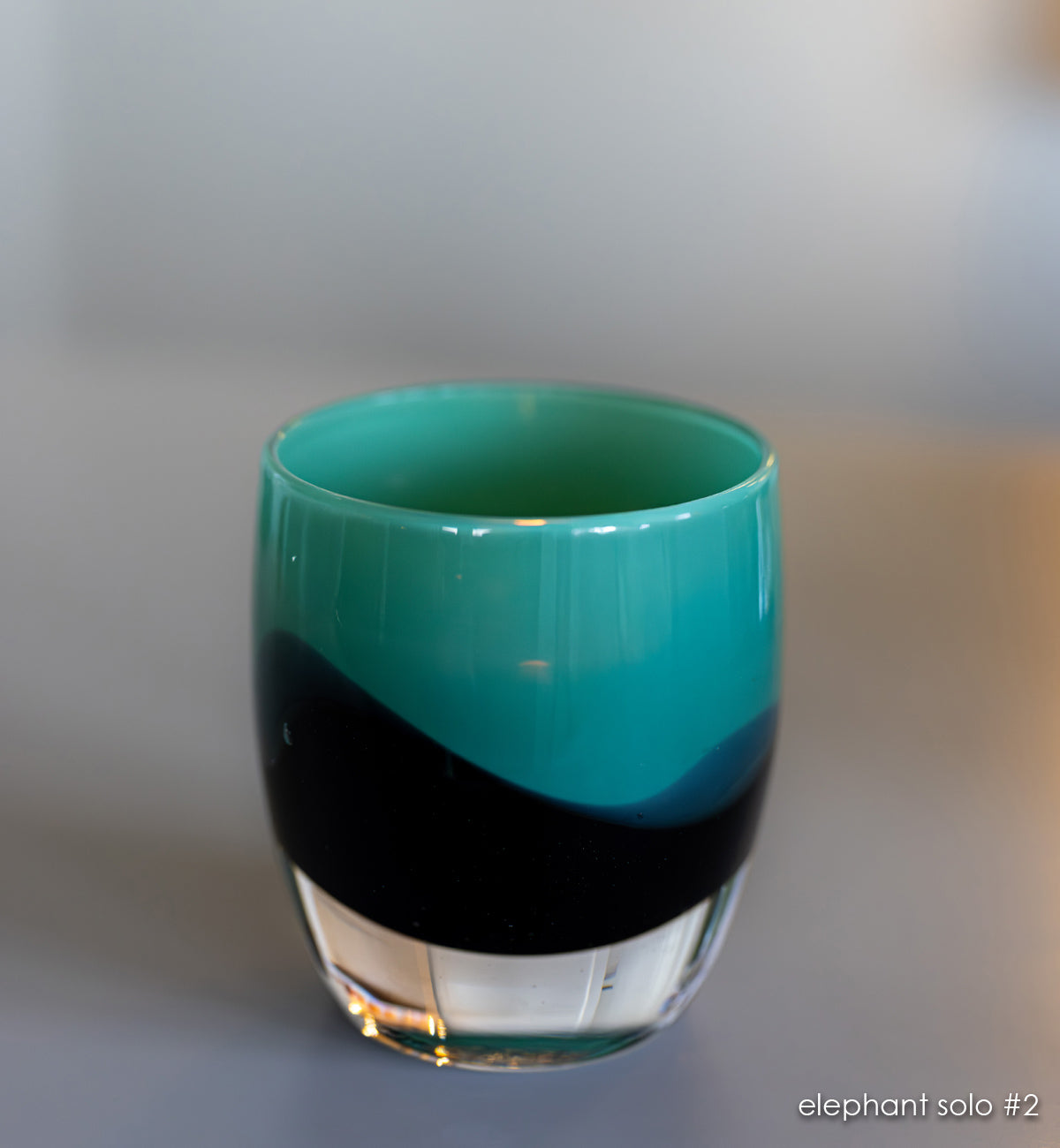 elephant solo #2 green/brown hand-blown glass candle holder.