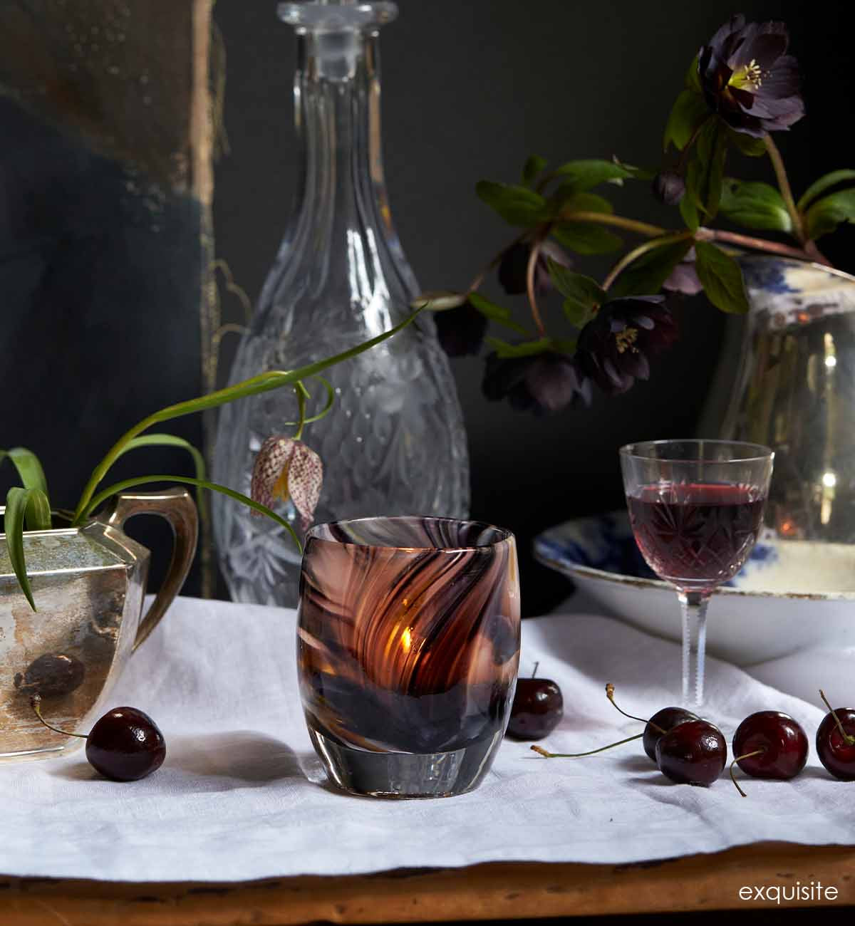 Exquisite lit on an abundant dining table