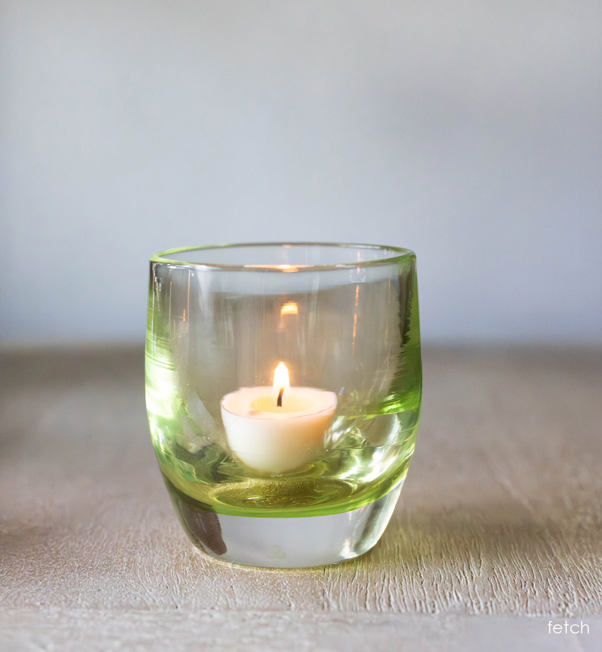'fetch' green transparent glassybaby hand-blown glass candle holder.