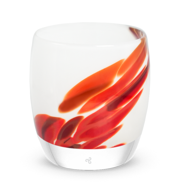 white and red patterned hand-blown glass candle holder.