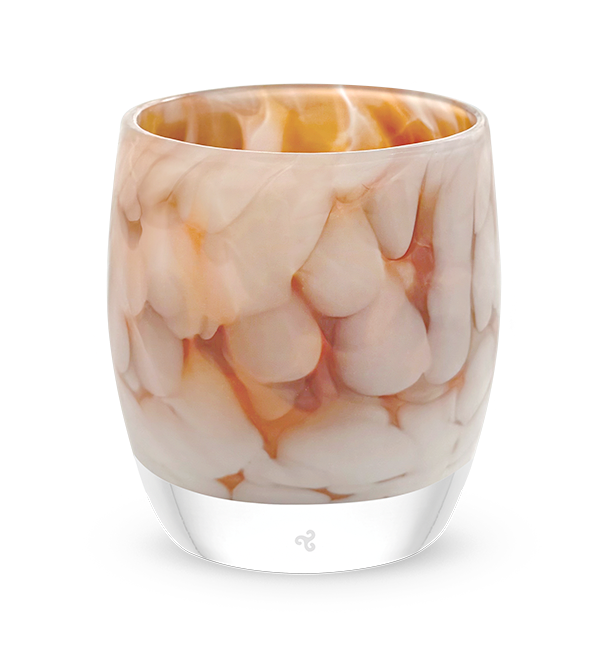 white and brown petal, hand-blown glass votive candle holder when lit gives off an orange glow
