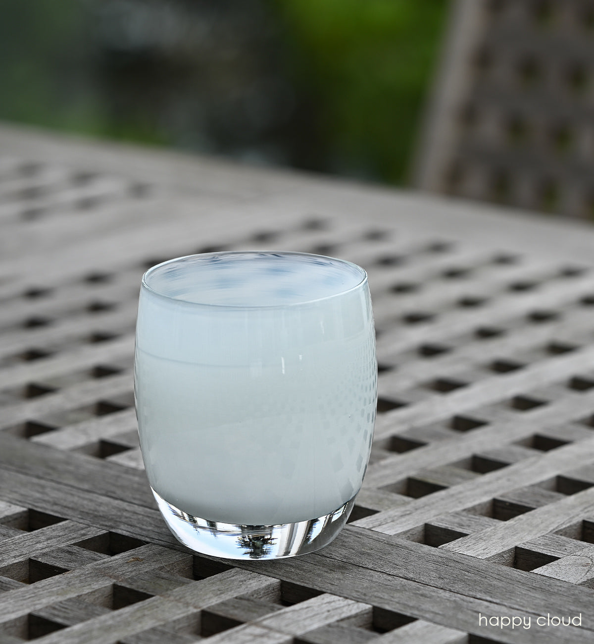 happy cloud light grey hand-blown glass votive candle holder.