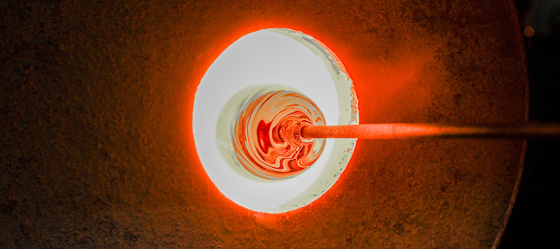 making hand-blown glass votive candle holder