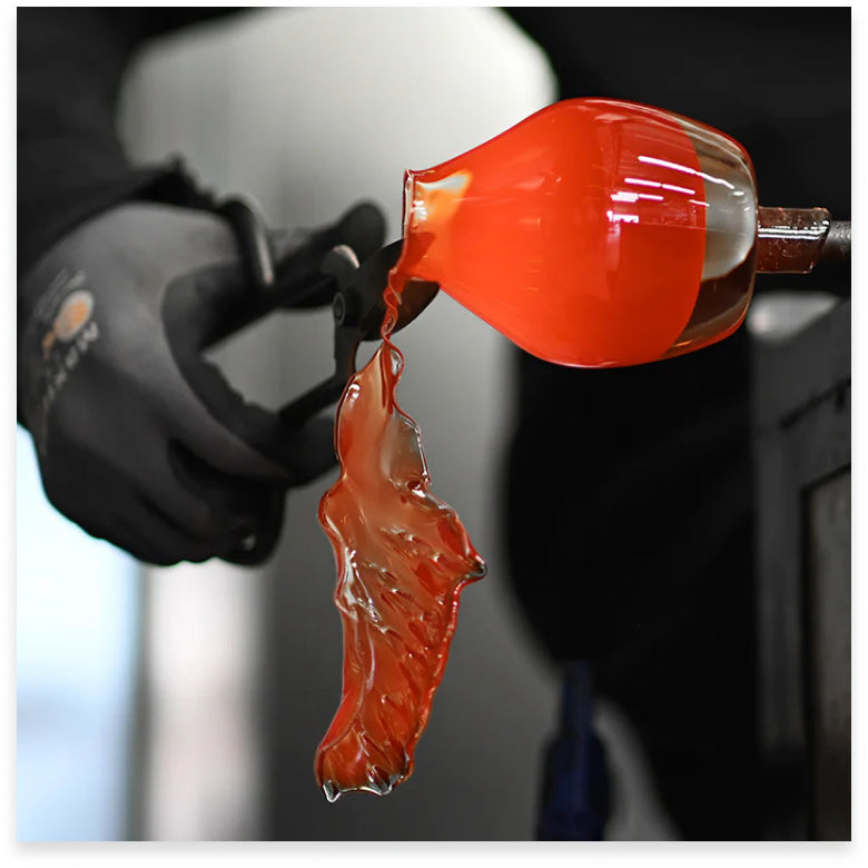 glassblower trimming lip of a glassybaby, hand-blown glass votive candle holder.