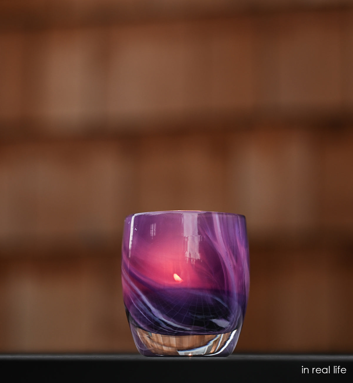 a beautiful swirling pattern of purple comes to life in every in real life hand-blown glass votive candle holder.