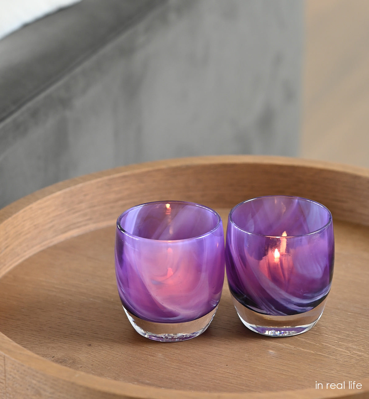 a beautiful swirling pattern of purple comes to life in every in real life hand-blown glass votive candle holder.