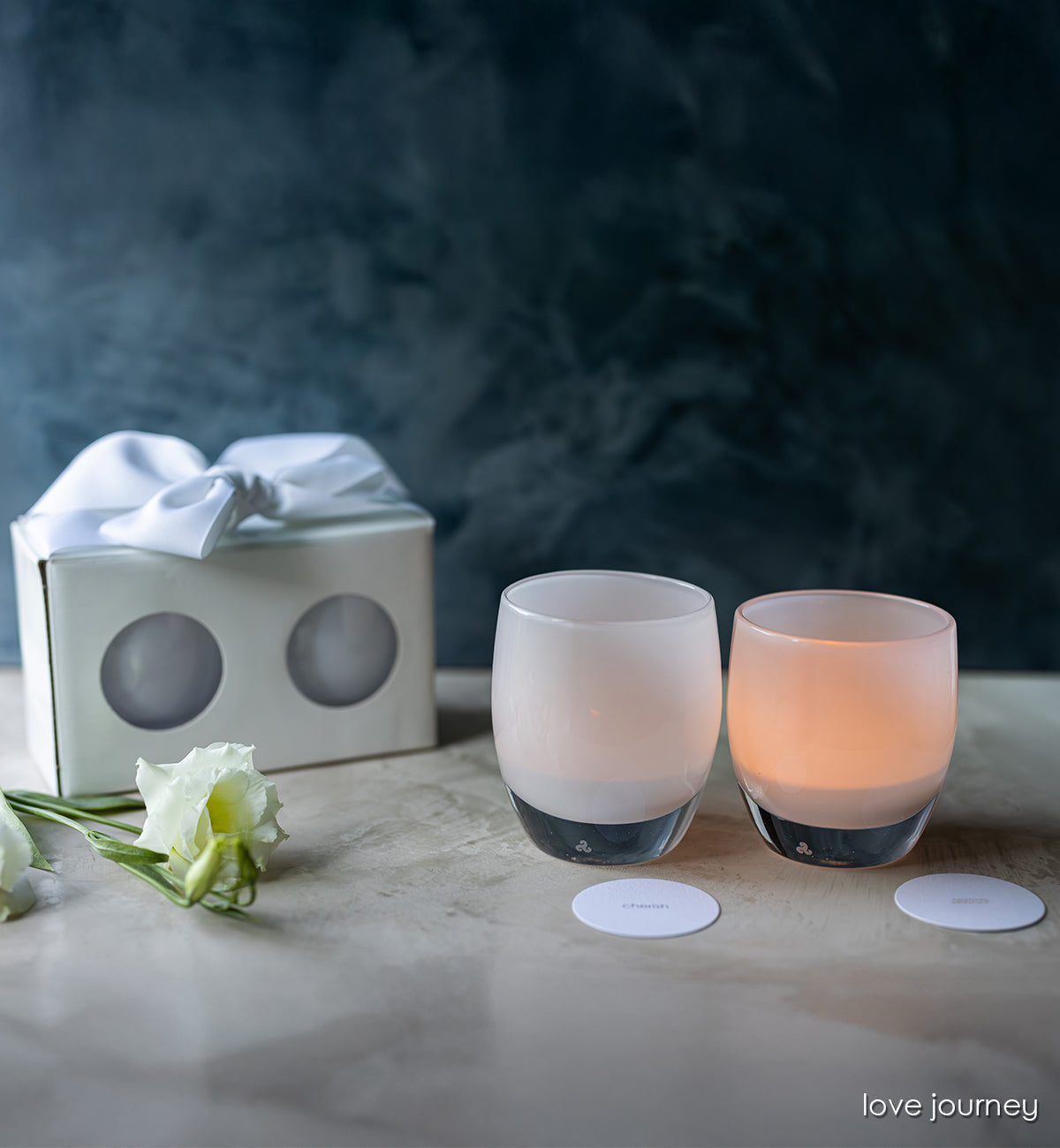 love journey set includes a cherish and a celebrate glassybaby. white lit hand-blown glass candle holders. with gift set box