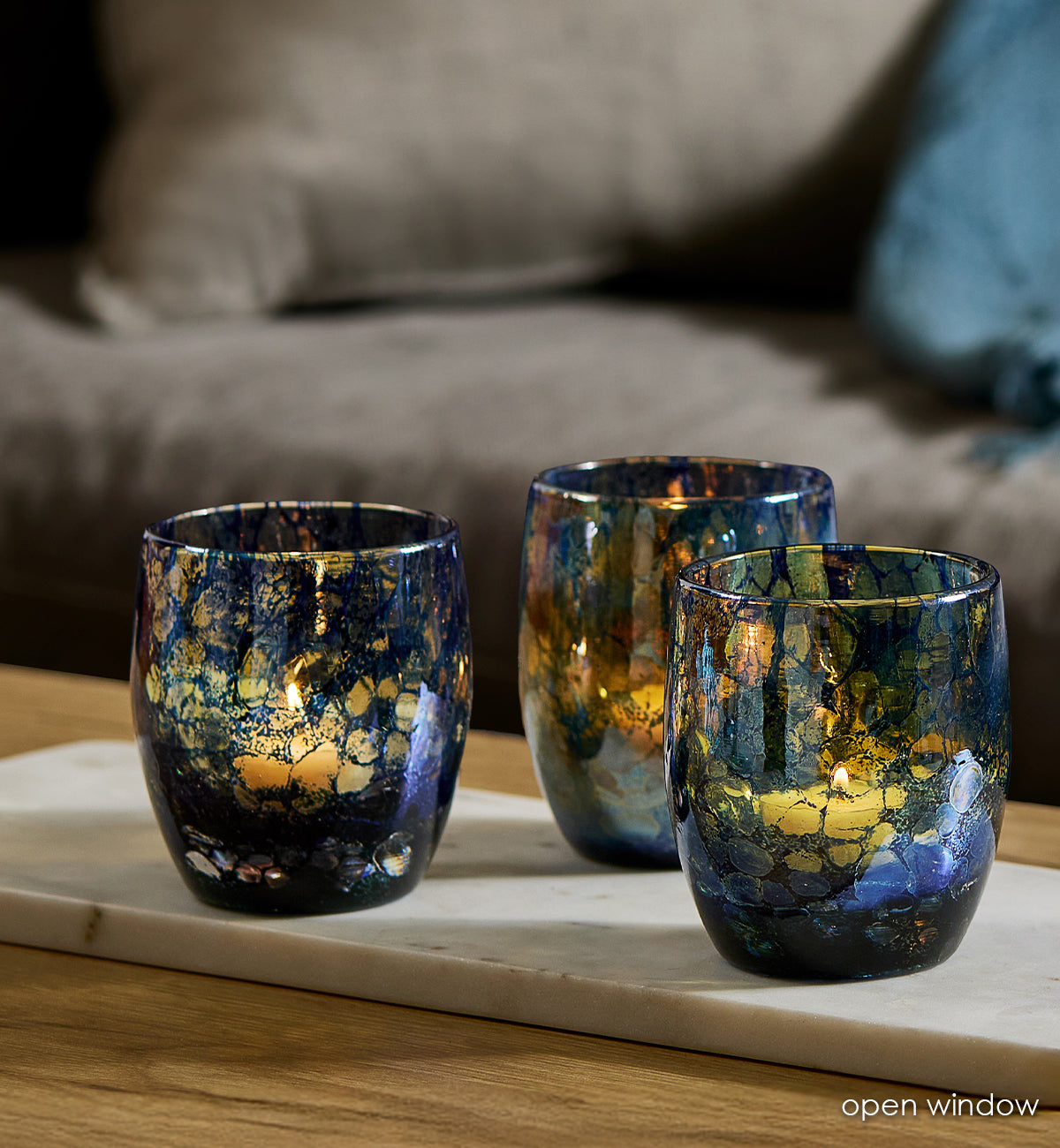 three blue with transparent specs hand-blown glass candle holders
