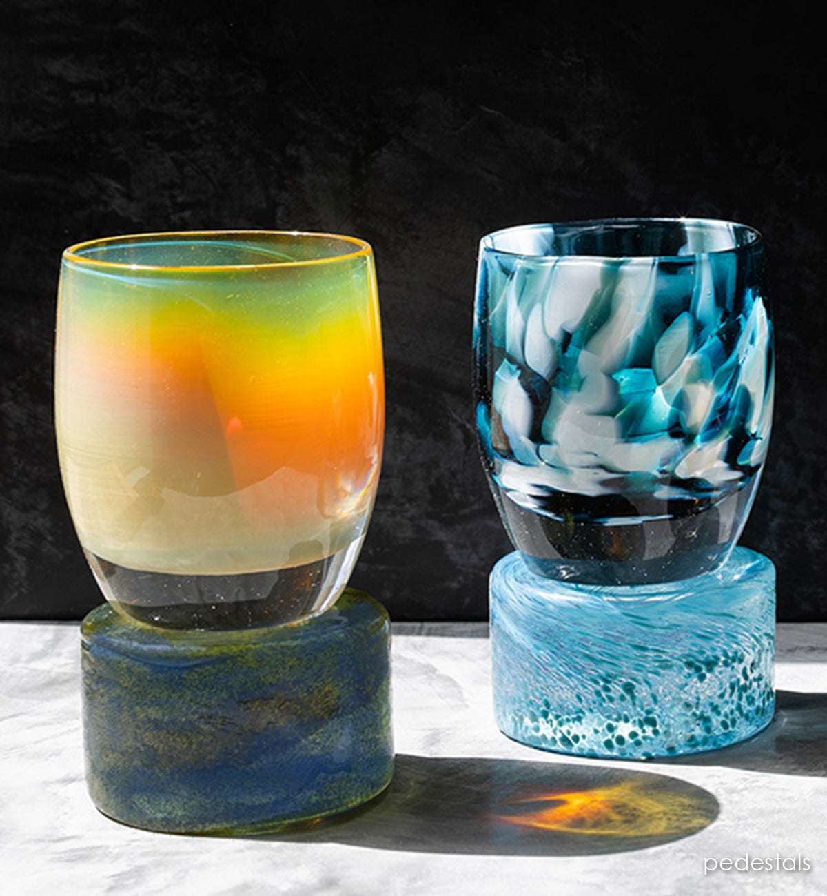 New pedestals elevate your colors. Hand-crafted glass pedestals with glassybaby sitting on top of them.