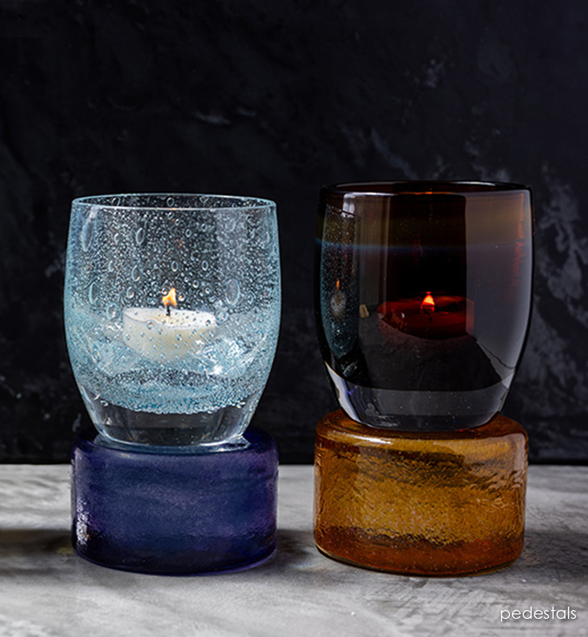 New pedestals elevate your colors. Hand-crafted glass pedestals with glassybaby sitting on top of them.