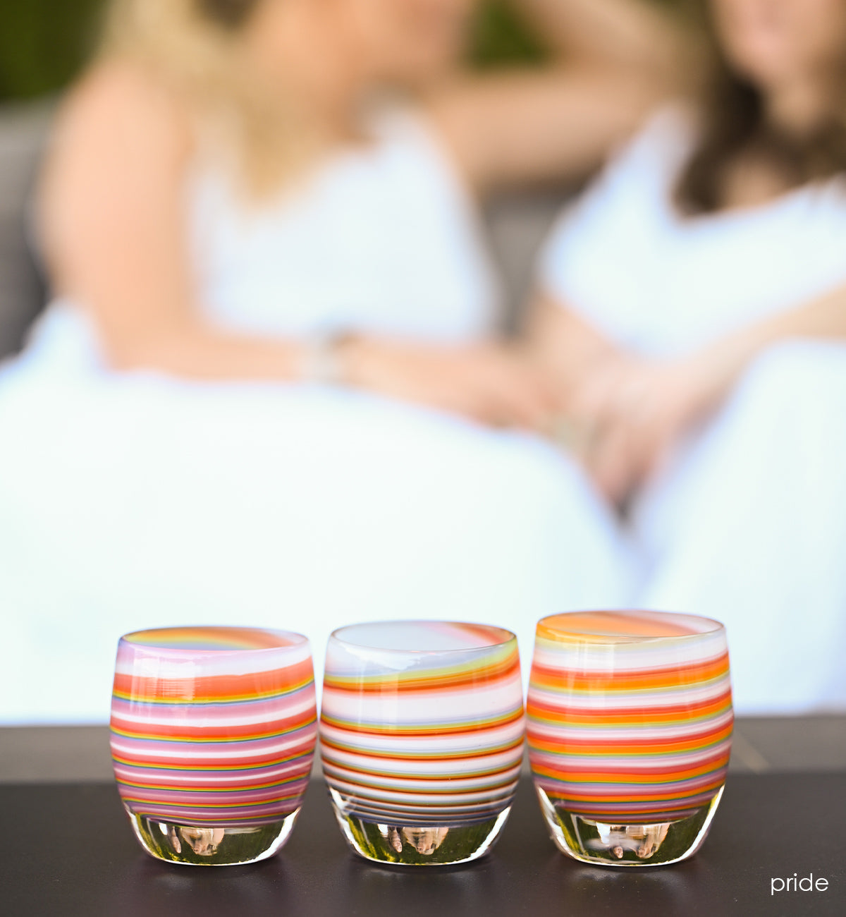 pride rainbow swirled, hand-blown glass votive candle holder.