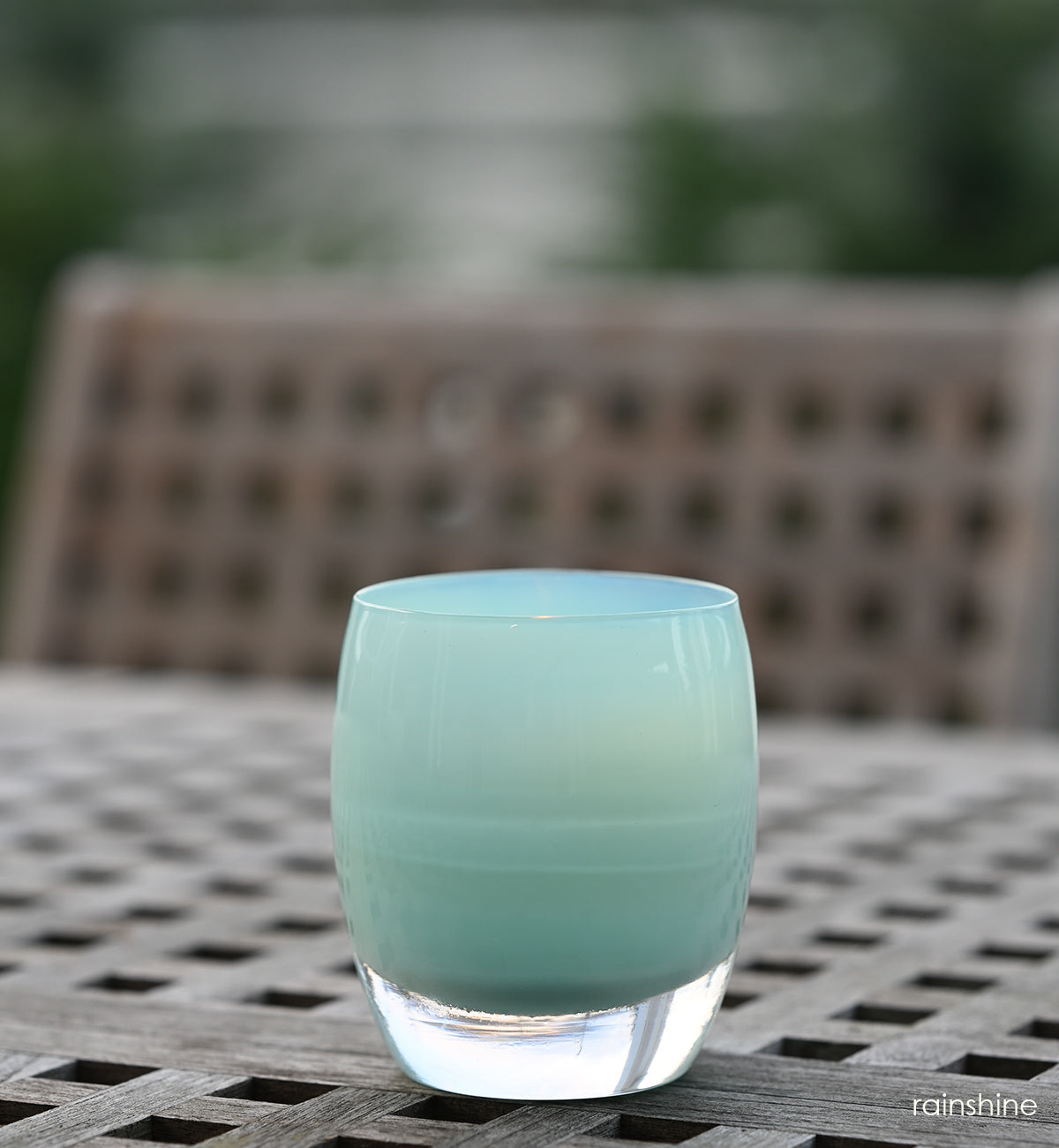 rainshine light teal hand-blown glass votive candle holder.