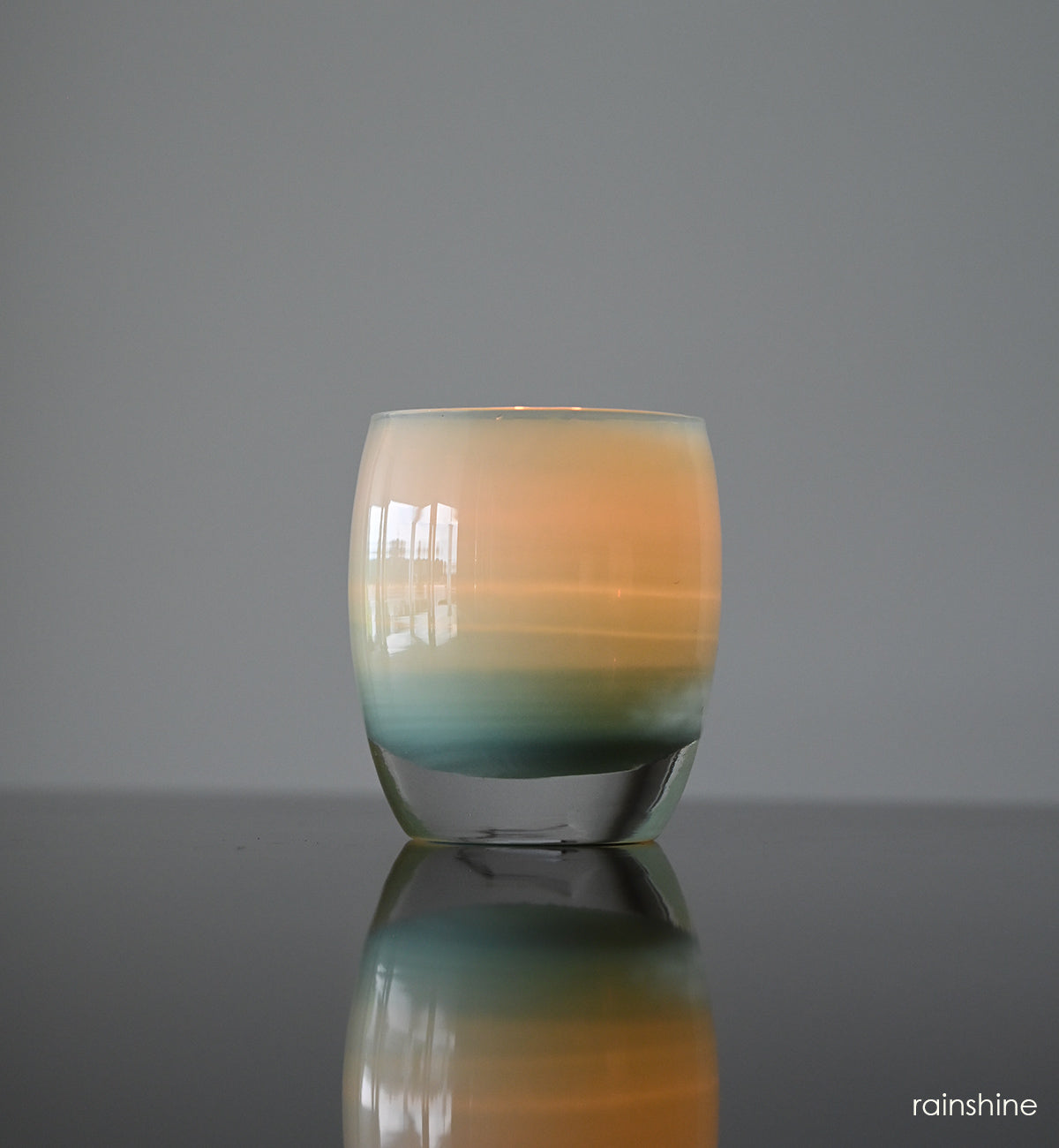 rainshine hand-blown light teal glass candle holder.