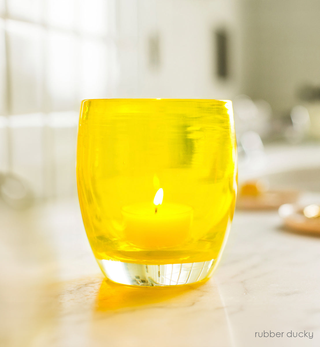rubber ducky | yellow hand-blown glass candle holder | glassybaby