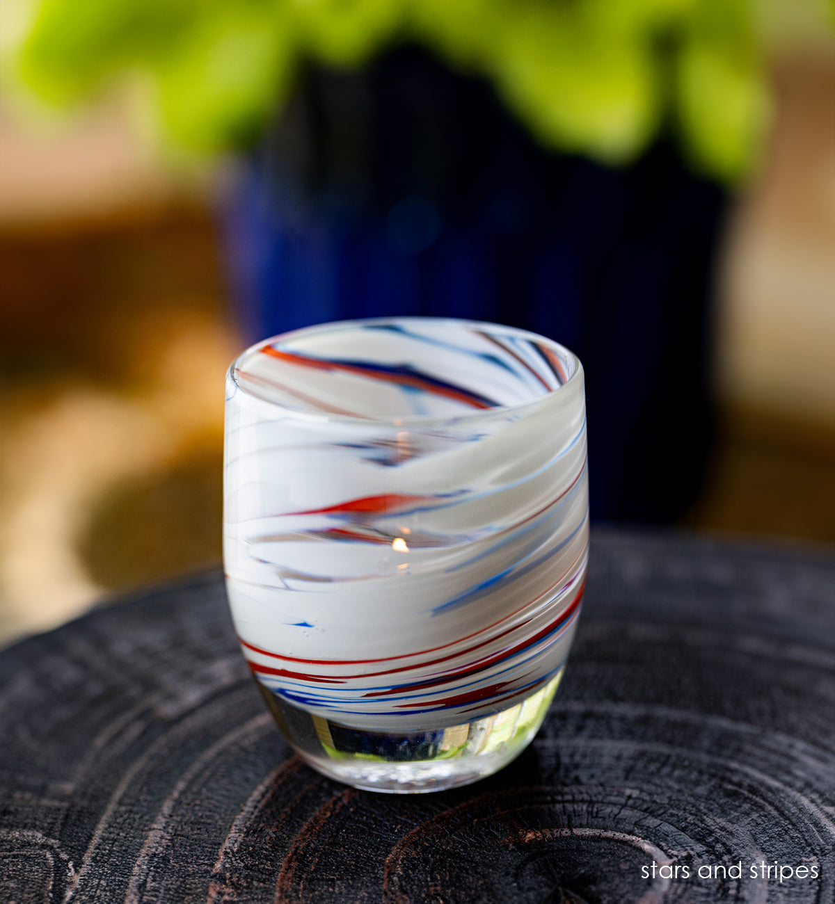 'stars and stripes' red white and blue hand-blown glass candle holder | glassybaby on wood table