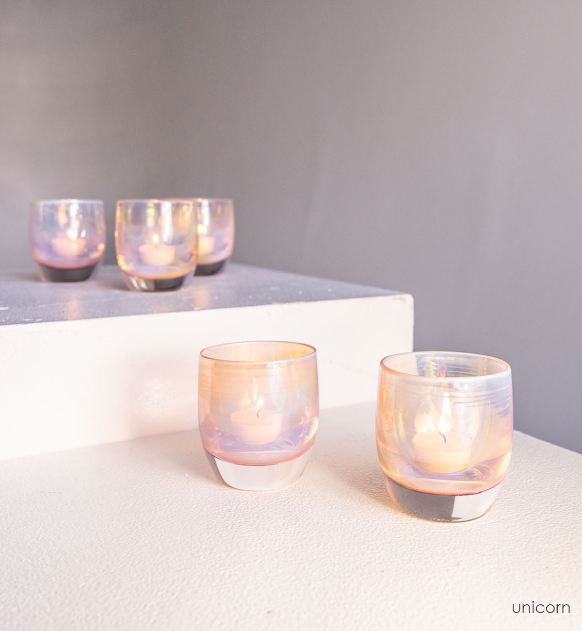 unicorn, iridescent pink hand-blown glass votive candle holder.