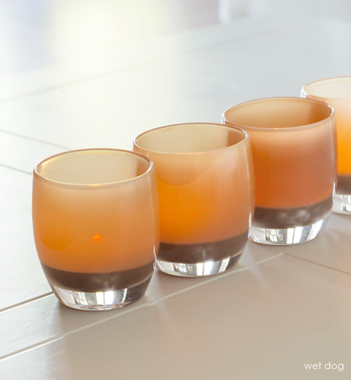 wet dog, two toned brown, hand-blown glass votive candle holder.