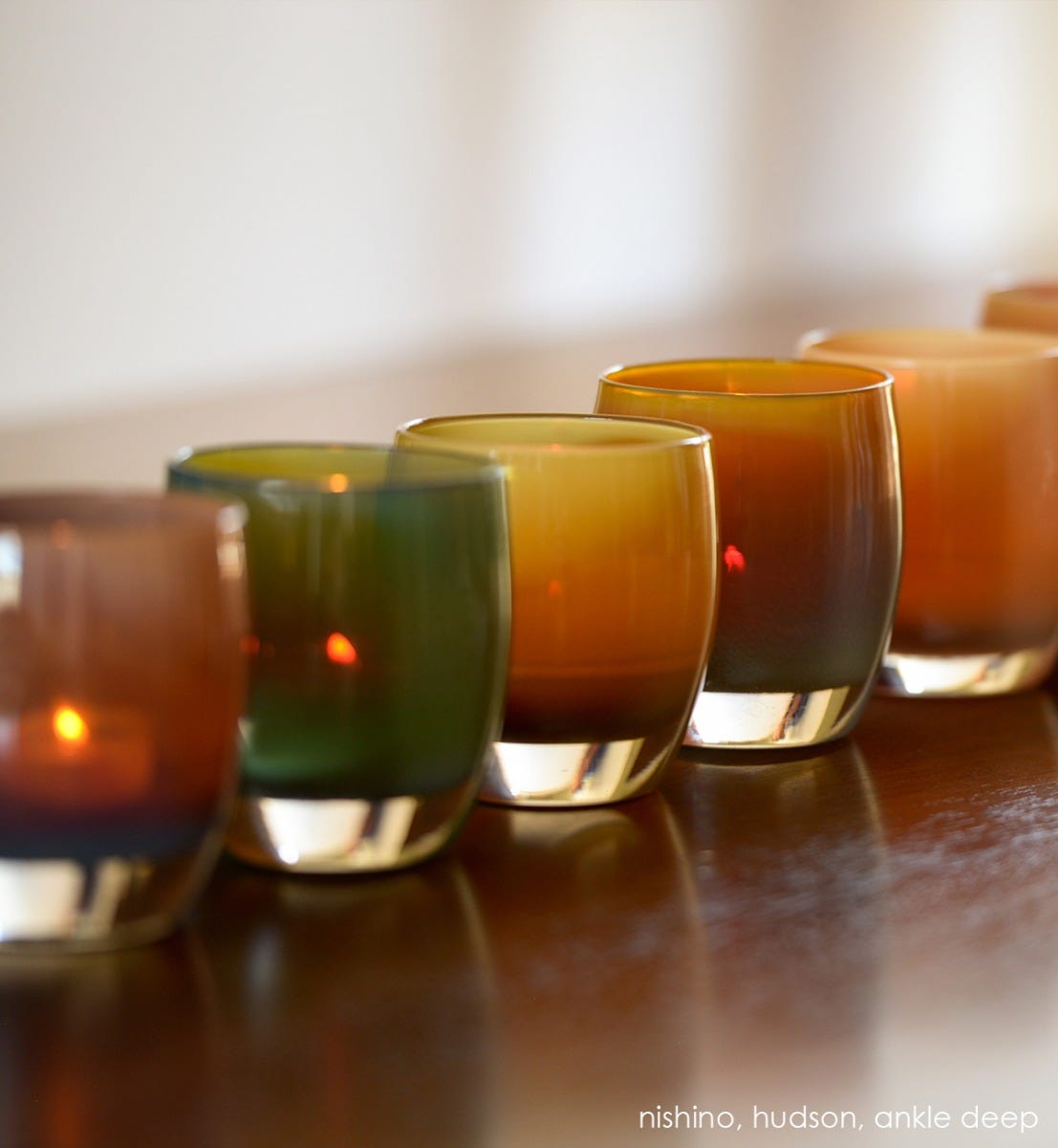 ankle deep dark brown, hand-blown glass votive candle holder. Paired with nishino and hudson.