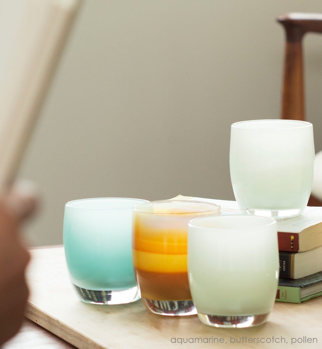 aquamarine hand-blown glass votive candle holder. Paired with butterscotch and pollen.