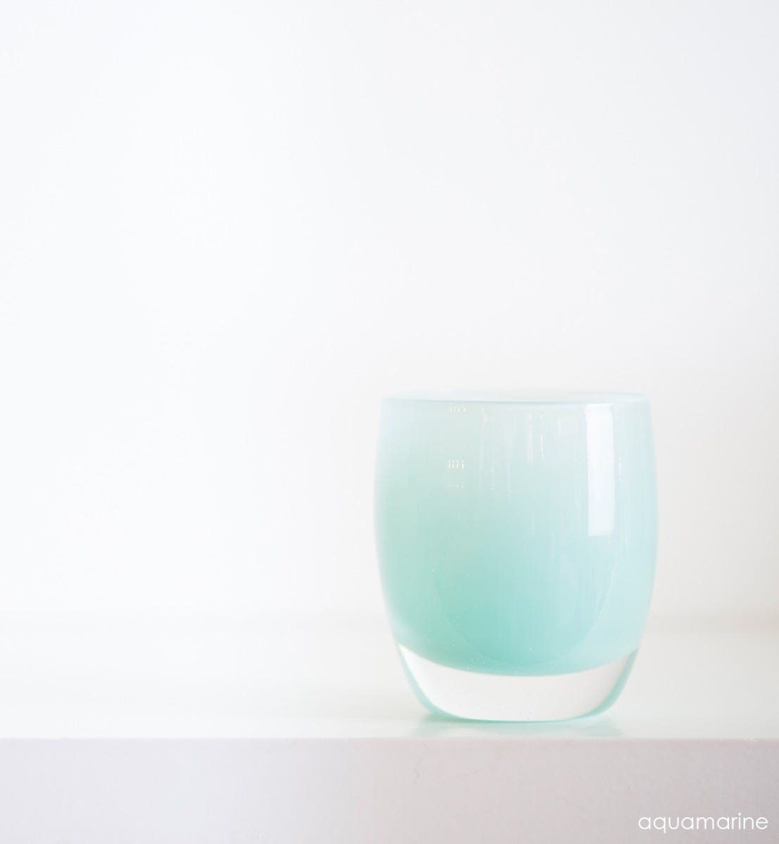 aquamarine hand-blown glass votive candle holder.