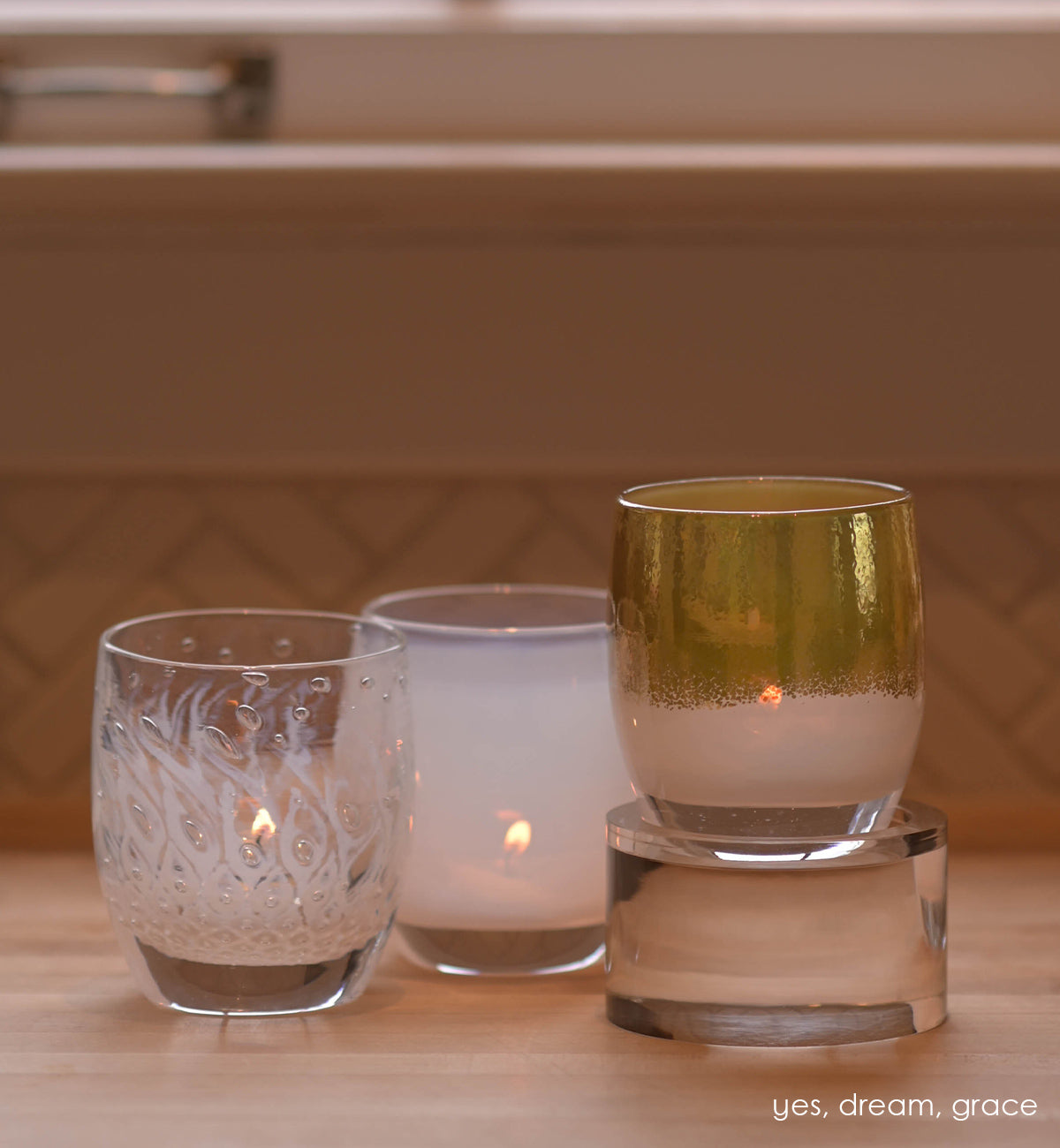 acrylic round baby stand for glassybaby hand-blown glass votive candle holder. Paired with yes, dream, and grace.