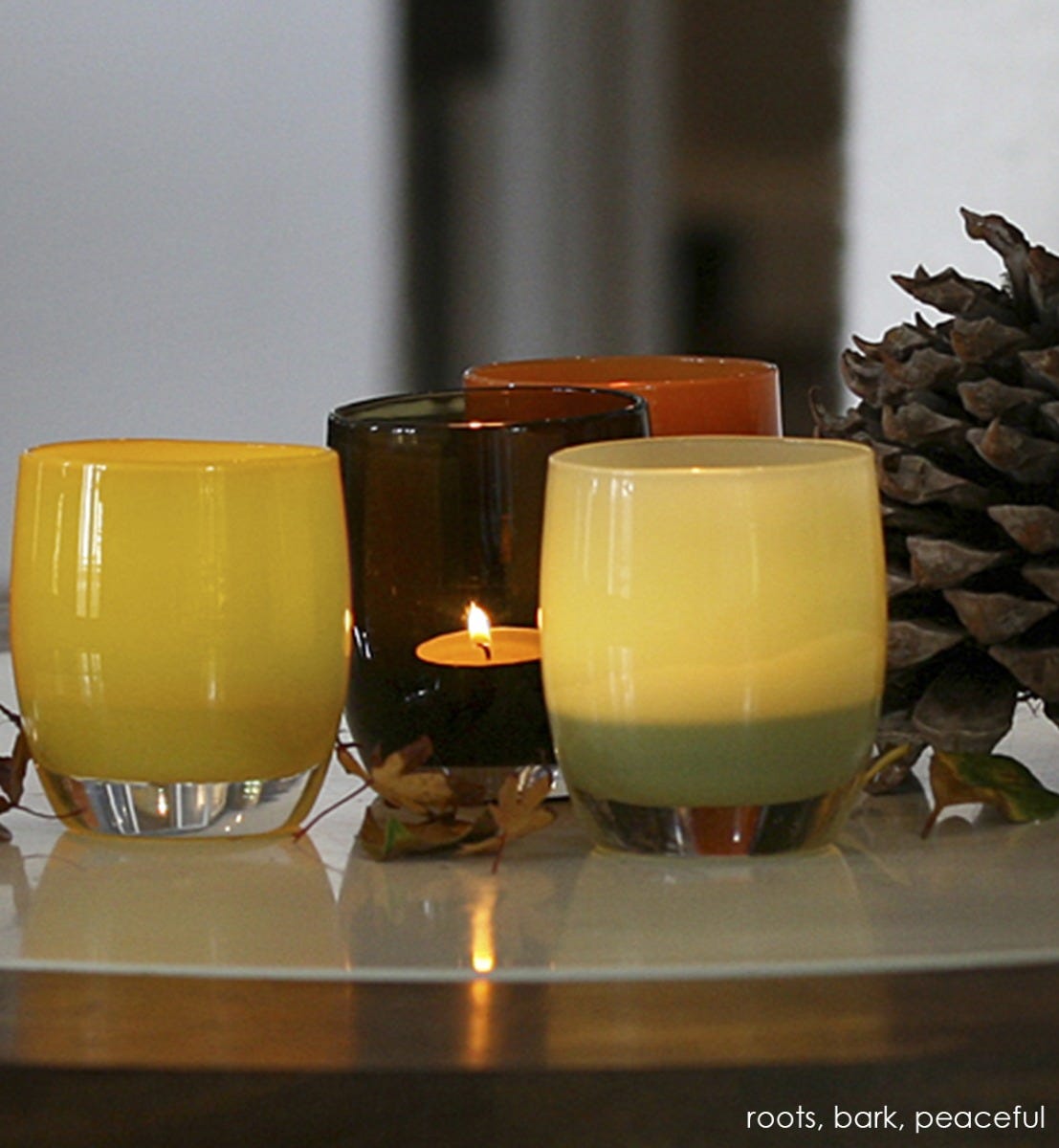 bark, transparent rich dark brown, hand-blown glass votive candle holder. Paired with roots and peaceful.