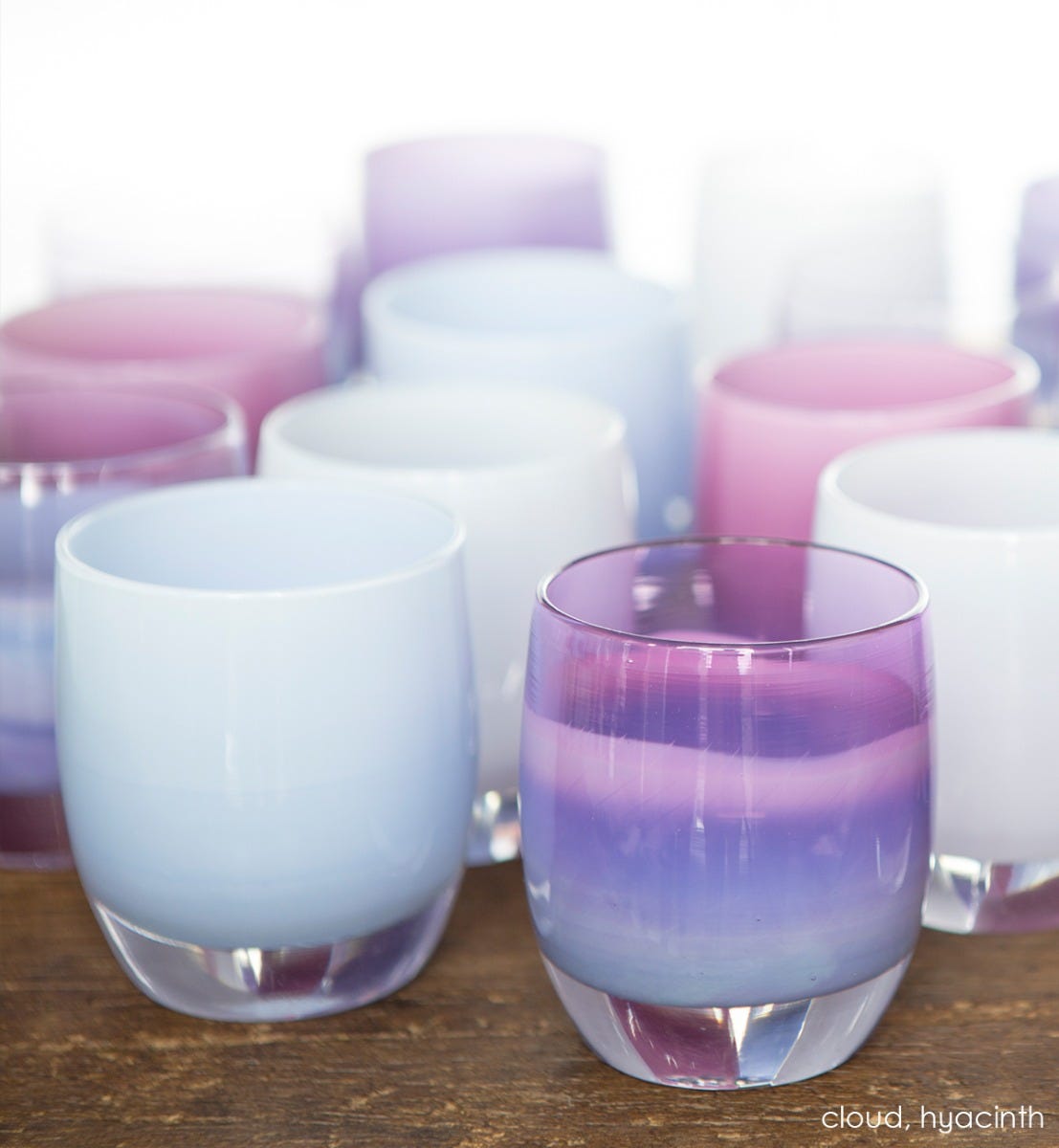  cloud light periwinkle hand-blown glass votive candle holder. Paired with hyacinth.