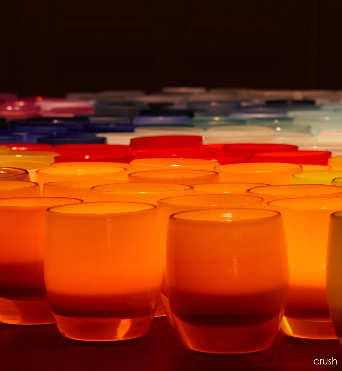 crush bright orange hand-blown glass votive candle holder