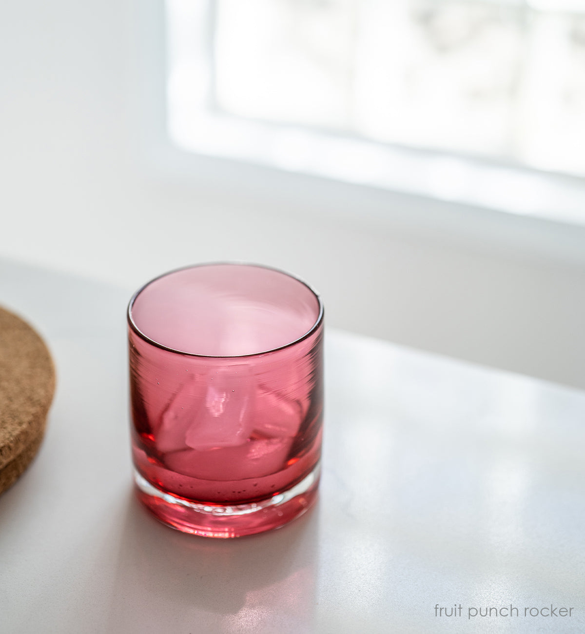 fruit punch rocker, transparent bright fuchsia hand-blown lowball glass.