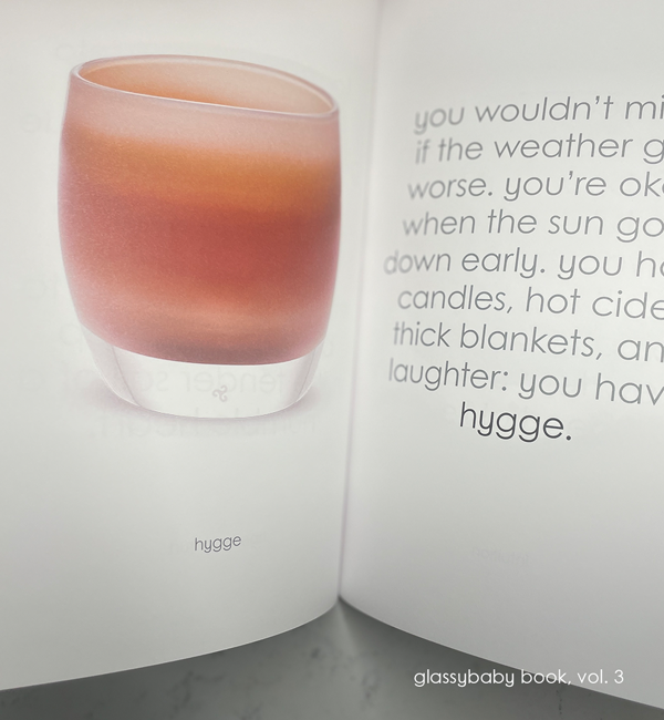coffee table book of glassybaby volume three, opened on hygge page.