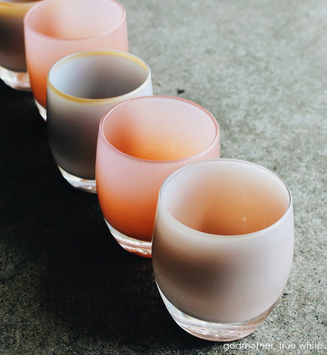 godmother, peach hand-blown glass votive candle holder. Paired with true white on a granite counter.