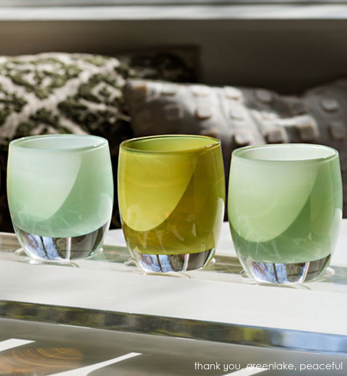 greenlake olive green hand-blown glass votive candle holder. Paired with thank you and peaceful.