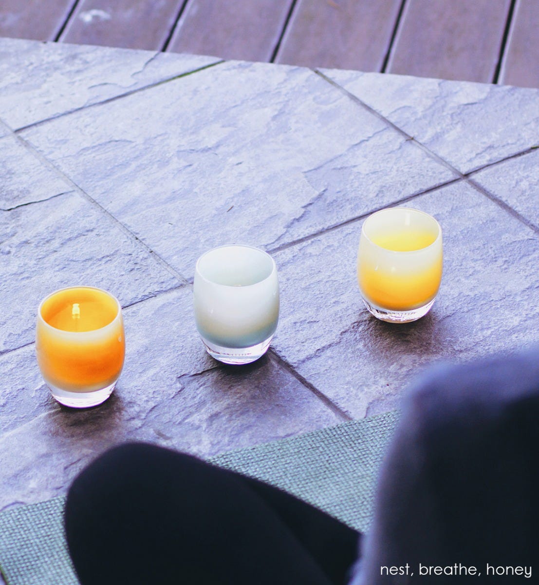 honey, light tan, hand-blown glass votive candle holder. Paired with nest and breathe.