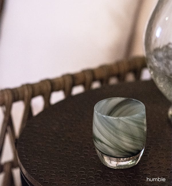 humble hand-blown grey black swirled glass candle holder.