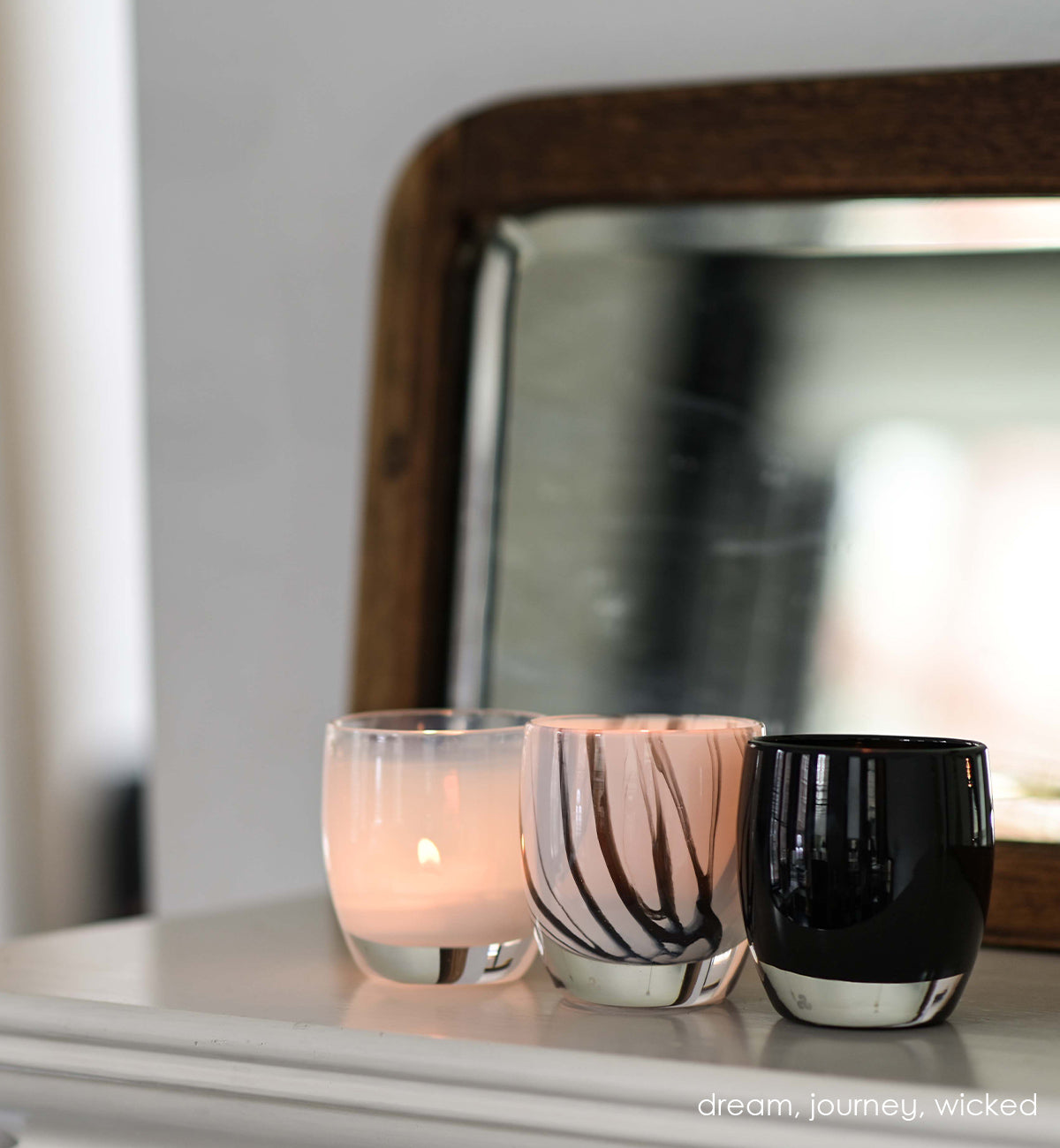 journey red and grey swirled hand-blown glass votive candle holder. Paired with dream and wicked.