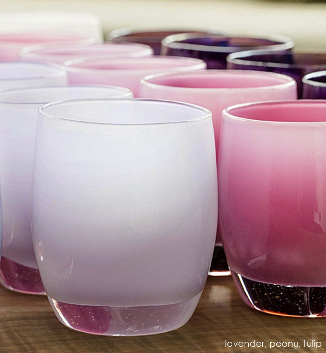 lavender hand-blown glass votive candle holder. Paired with peony and tulip.